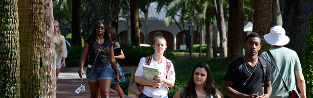 students walking in palm court
