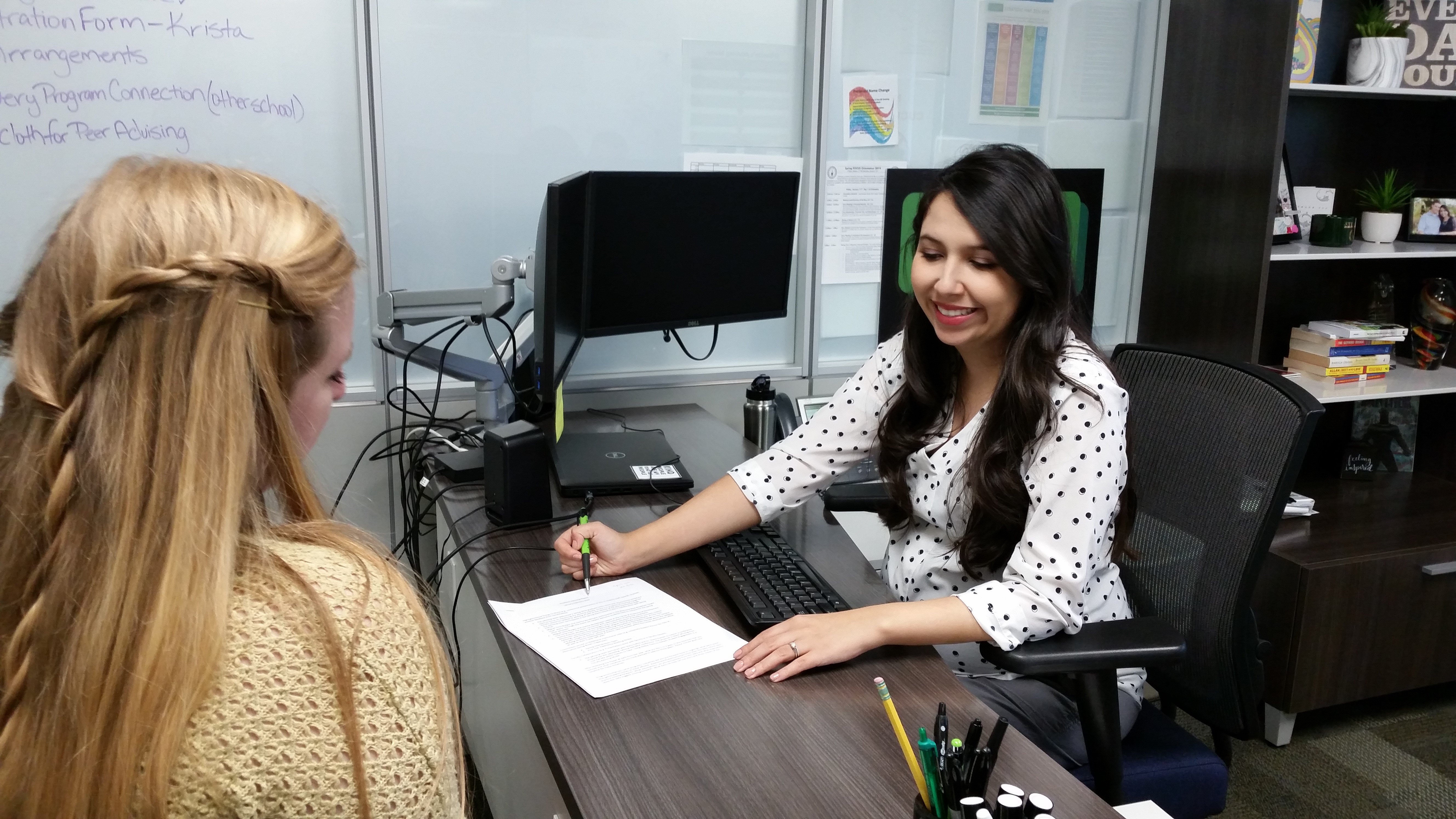 Joanne having an advising meeting with a student