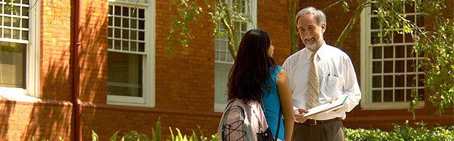 Professor and Student talking outside of a building