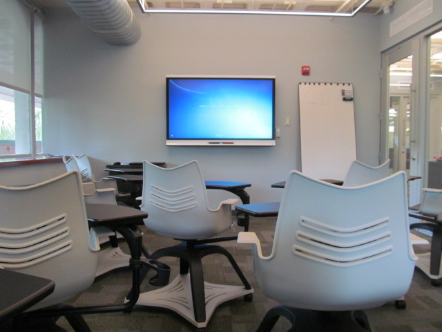 Smartboard Room with rolling chairs and a smart television