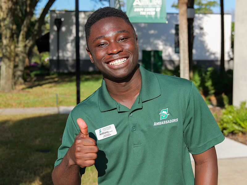 a student ambassador giving a thumbs up