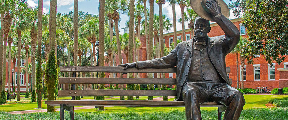 a statue of John B. Stetson sitting on a bench waiting for people