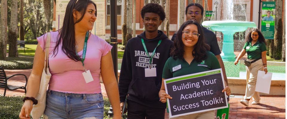 student ambassador guiding group outside