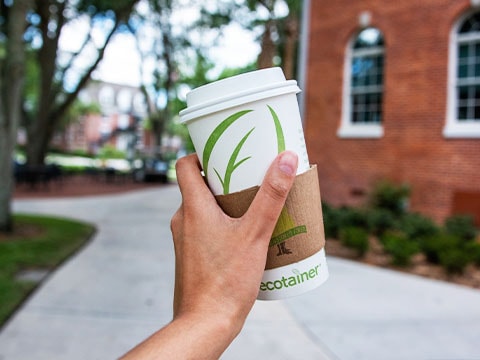 hand holding coffee cup