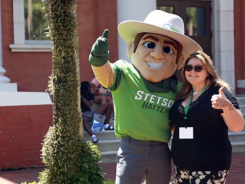 student with school mascot