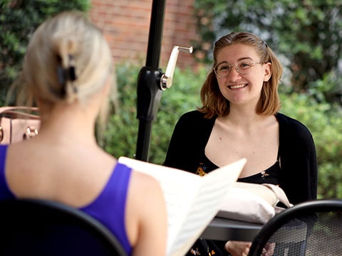 two people talking outside