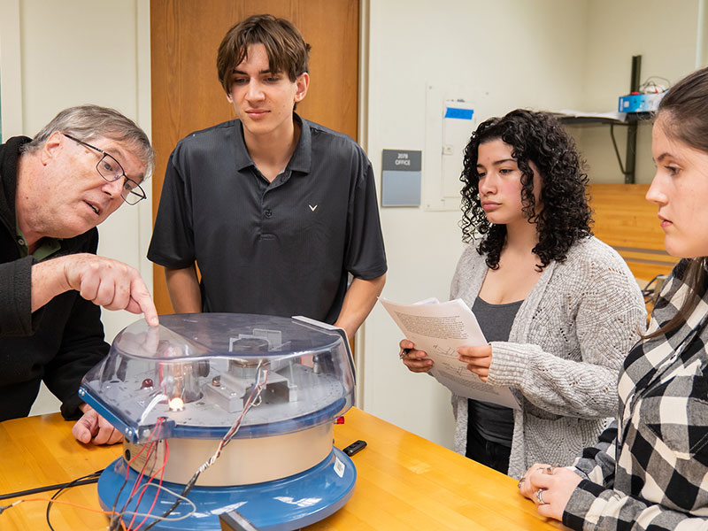 students in a science classroom with professor