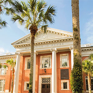 Sampson Hall from the Palm Court view on a sunny day.