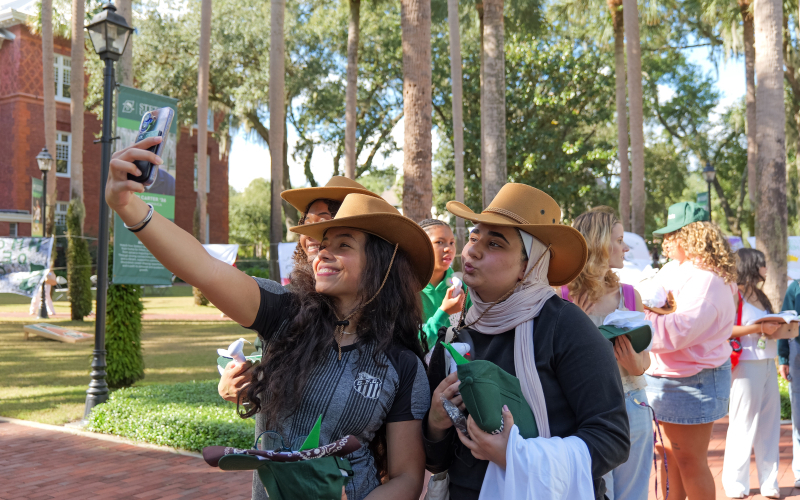 stetson students taking a selfie together during an event