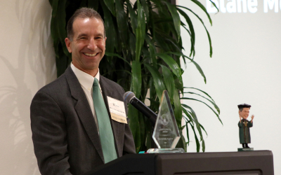 alumni receiving an award