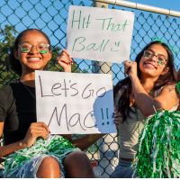 Students cheering at baseball game