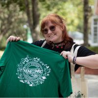 student showing homecoming 2025 t-shirt