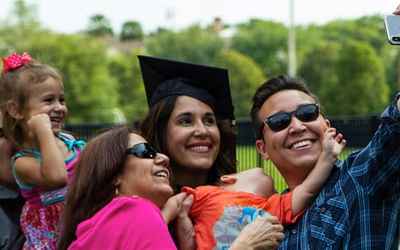 stetson graduate and family taking a selfie at the ceremony
