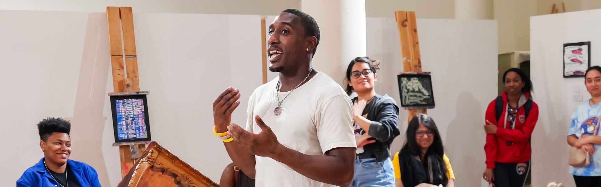 Student presenting to other students on gallery