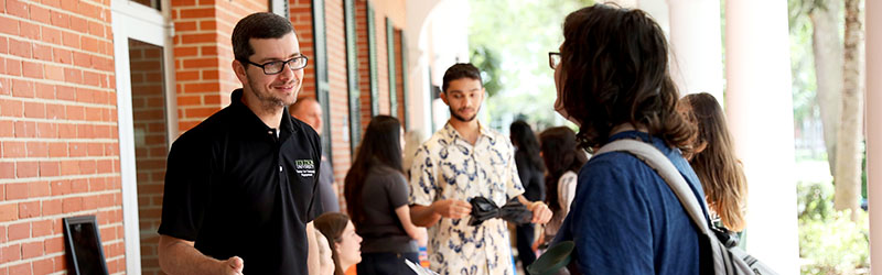 professor speaking with student outside the CUB