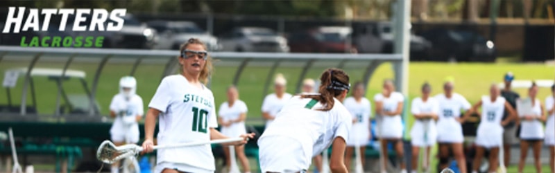 Women's Lacrosse playing team during game