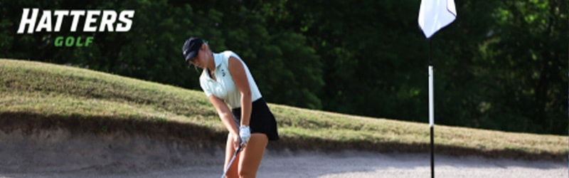 student playing golf