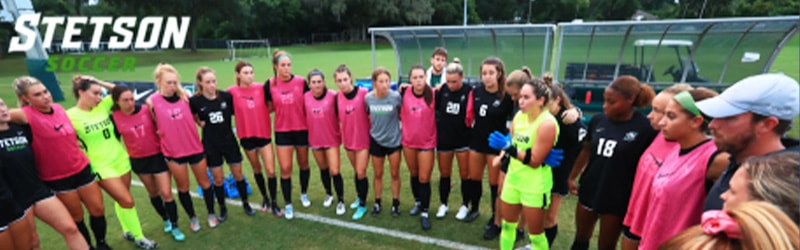 Women's Soccer team on the field around each other