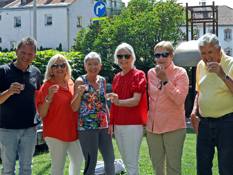 people from trip toasting outside