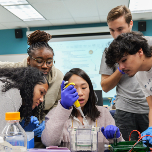 professor showing students lab experiment