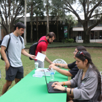person updating information at table