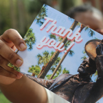 hand holding thank you card