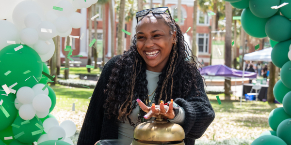 new student rining bell at hatter saturday