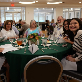 students and alumni at showcase luncheon