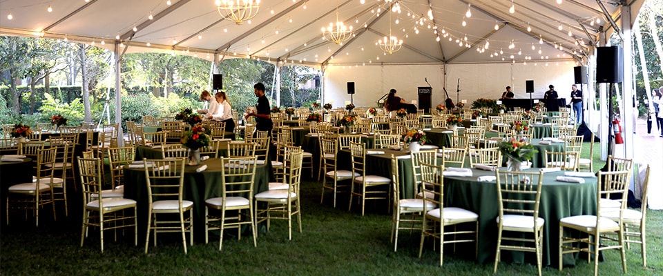 event setup with chairs and tables decorated