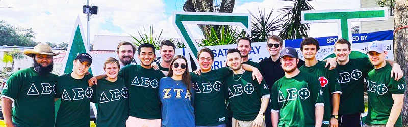 students from fraternity posing and smiling together