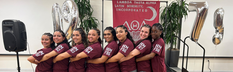  group of students hugging each other with their sorority shirts