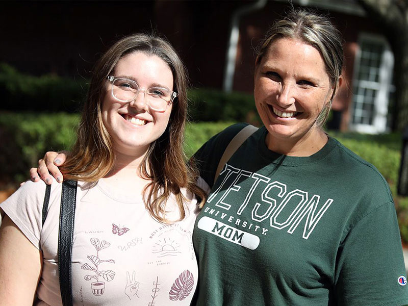 student and parent posing for picture