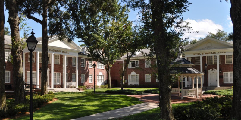 The brick and white paint exterior of Carson and Hollis Halls
