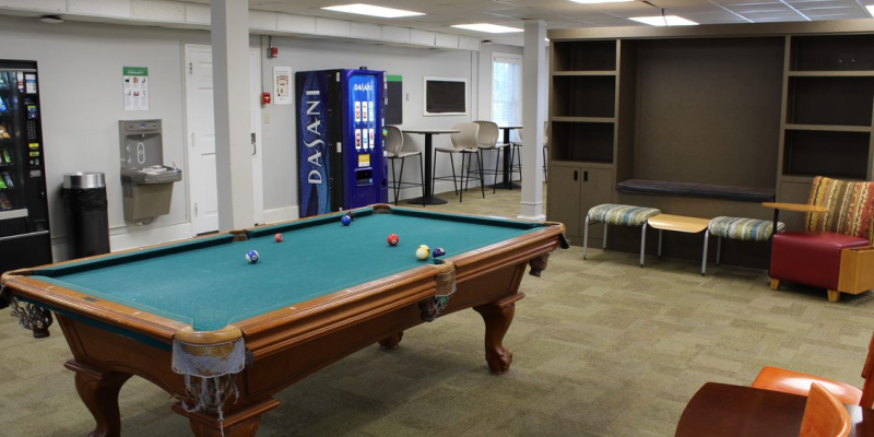 The lounge of Emily Hall, with a billiard table, bending machine, tables and chairs