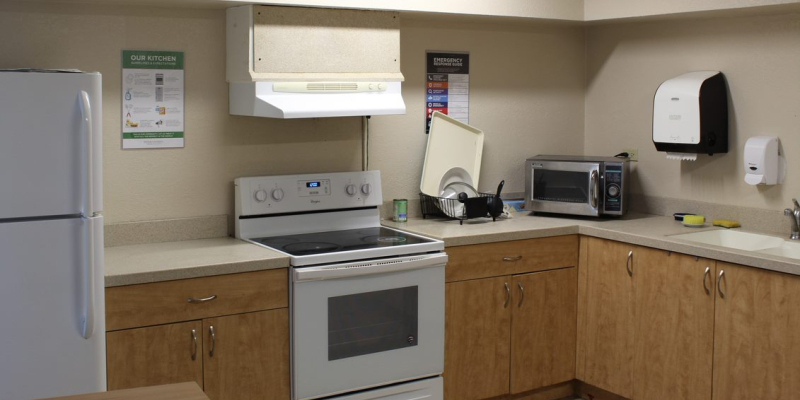 Kitchen in Emily Hall, with oven, stove, sink, microwave and fridge