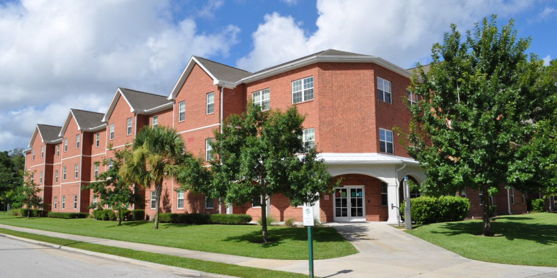 The red brick and white paint exterior of Hatter Hall