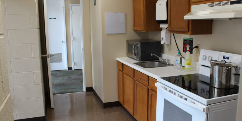 Kitchen of Nemec Hall, with microwave, oven, stove and sink