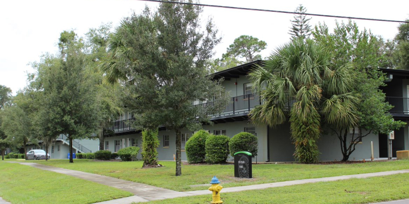The green paint exterior of Stetson Oaks Apartments