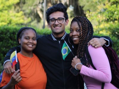 students from Hillel with professor in front of statue