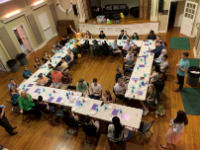 Shabbat dinner with students sitting around the dinner tables