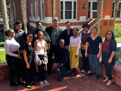 a group od peopel posing outside of Stetson building