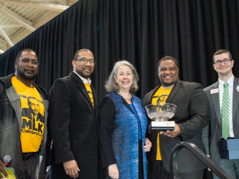 5 Stetson staff and former Stetson President, Wendy Libby, posing for MLK Community Breakfast event