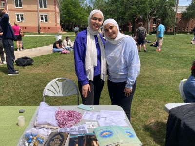 two students from the muslim student association tableling