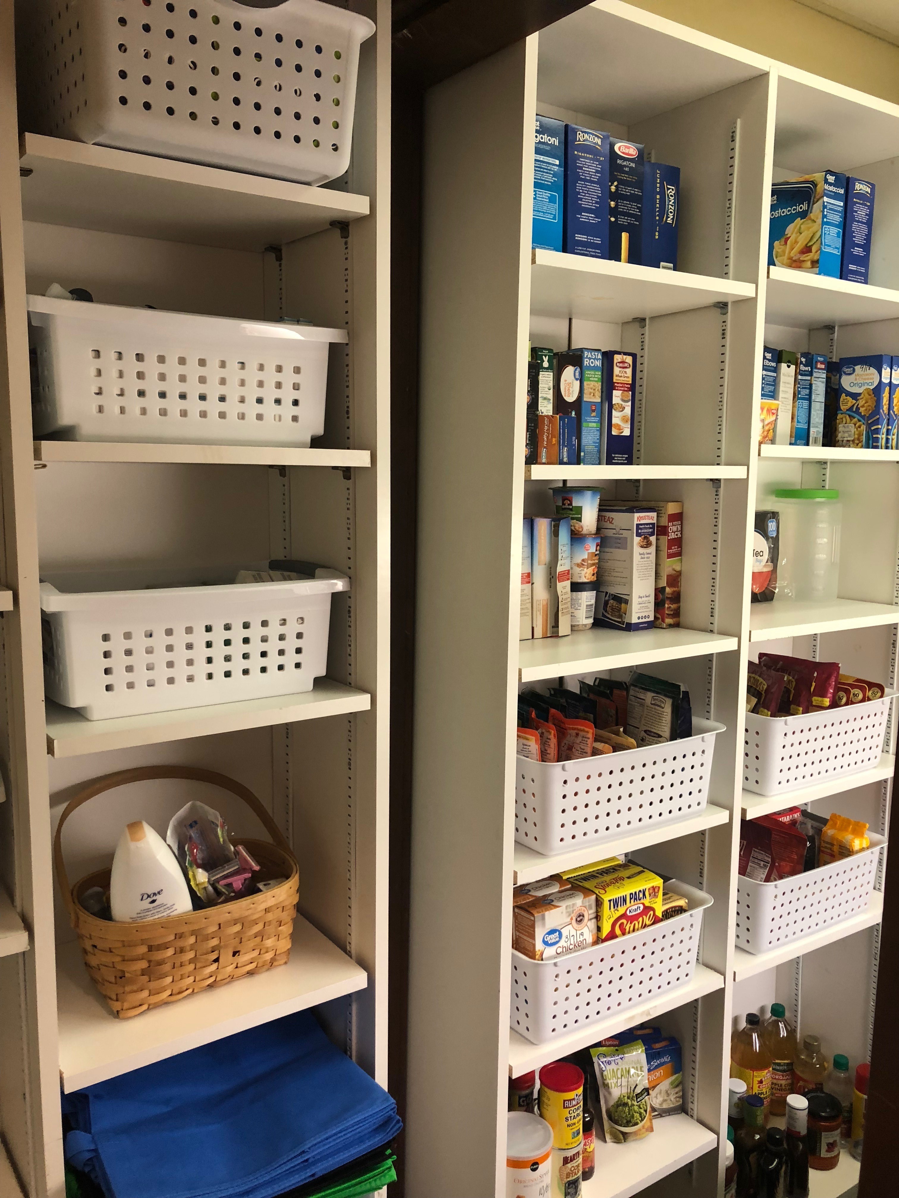 A neatly organized food pantry, containing an assortment of dry goods and personal care items