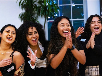 four excited students from LSU