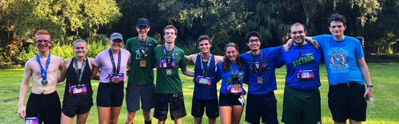 students from the running club posing together after a run