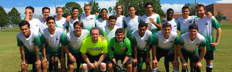 group of students from the soccer team smiling together