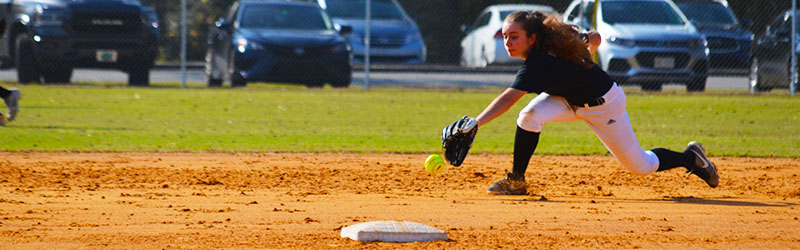 student about to catch a ball