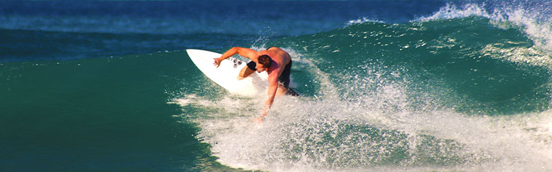 Student surfing on a big wave