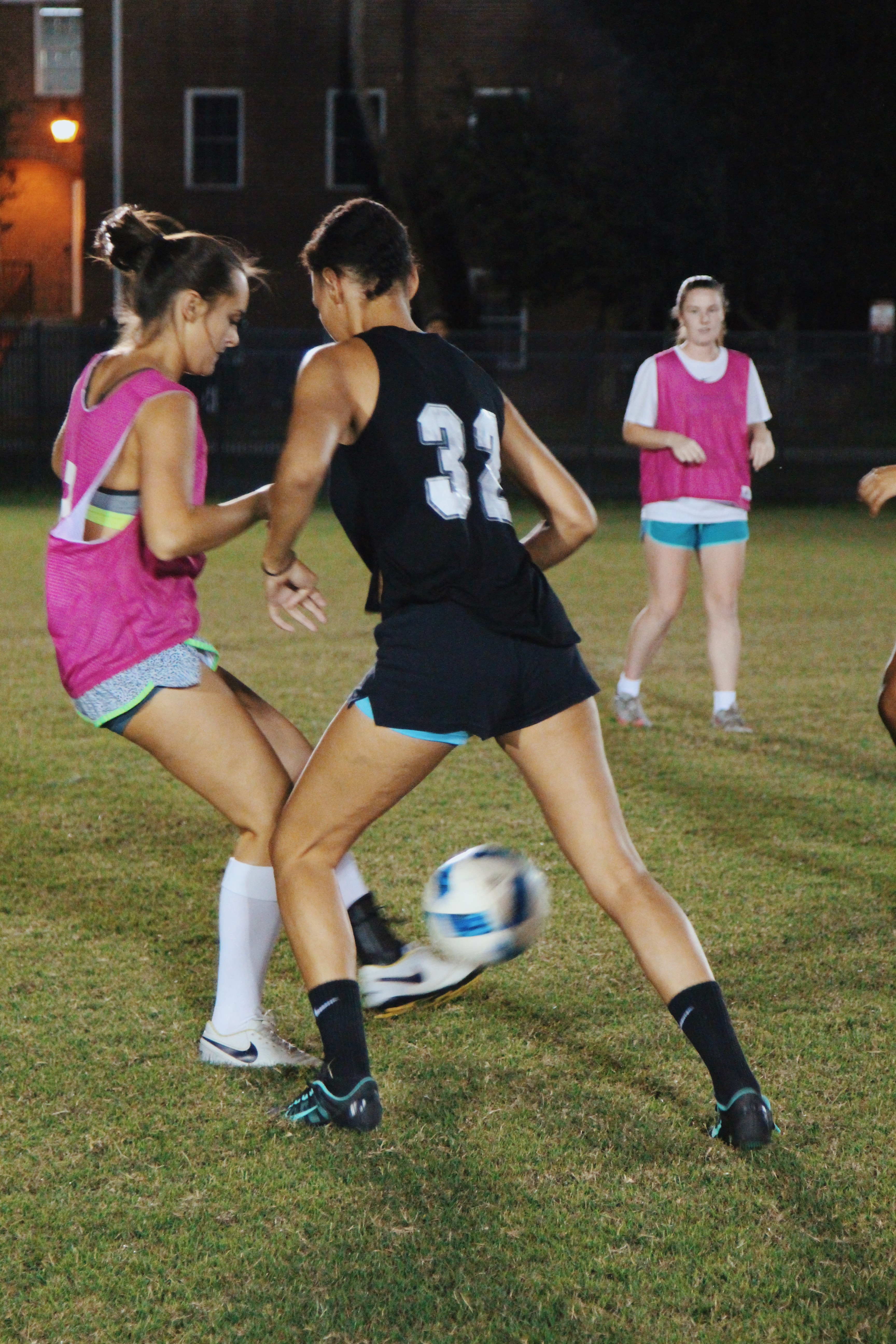 student running with ball playing flag football